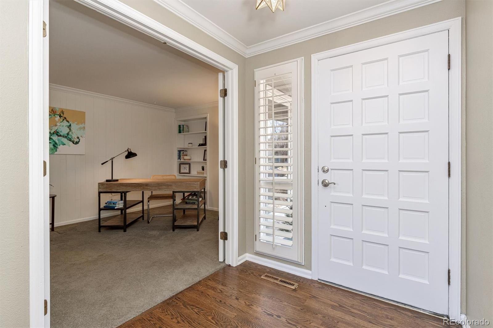 6145 South Eudora Way Centennial, CO 80121 - Photo 4 of 33 wooden floor in an empty room with a window