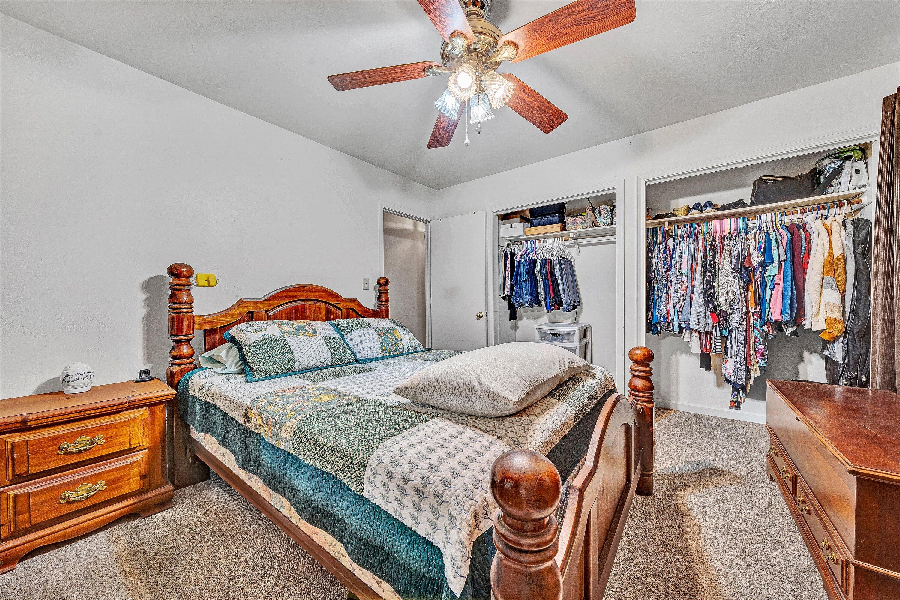 117 Country Lane Thaxton, VA 24174 - Photo 18 of 35 a bedroom with bed and a chandelier