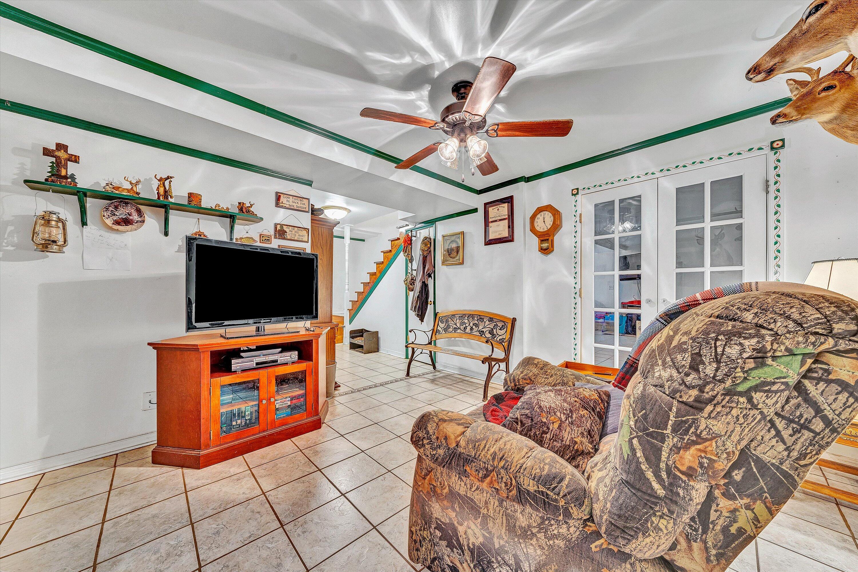 117 Country Lane Thaxton, VA 24174 - Photo 21 of 35 a living room with furniture and a flat screen tv