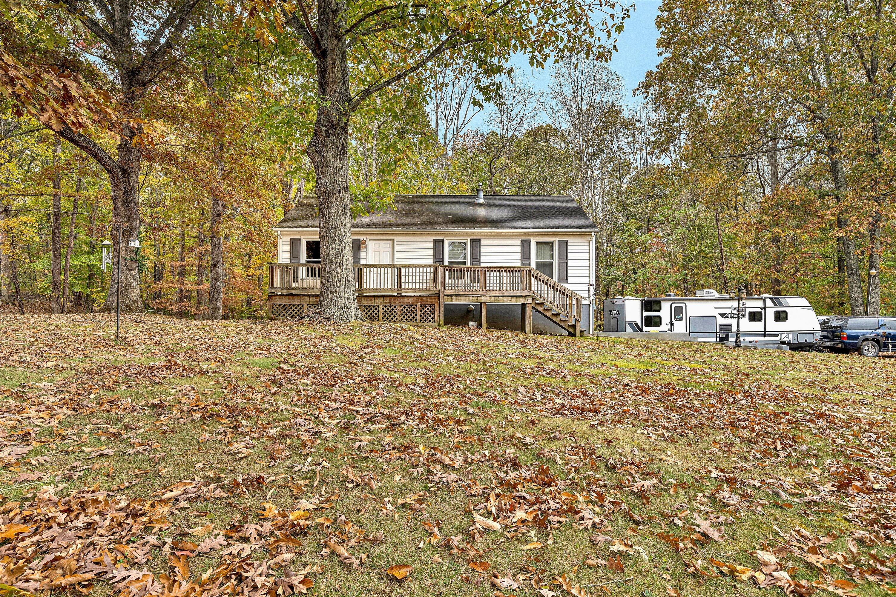 117 Country Lane Thaxton, VA 24174 - Photo 3 of 35 front view of a house with a large tree
