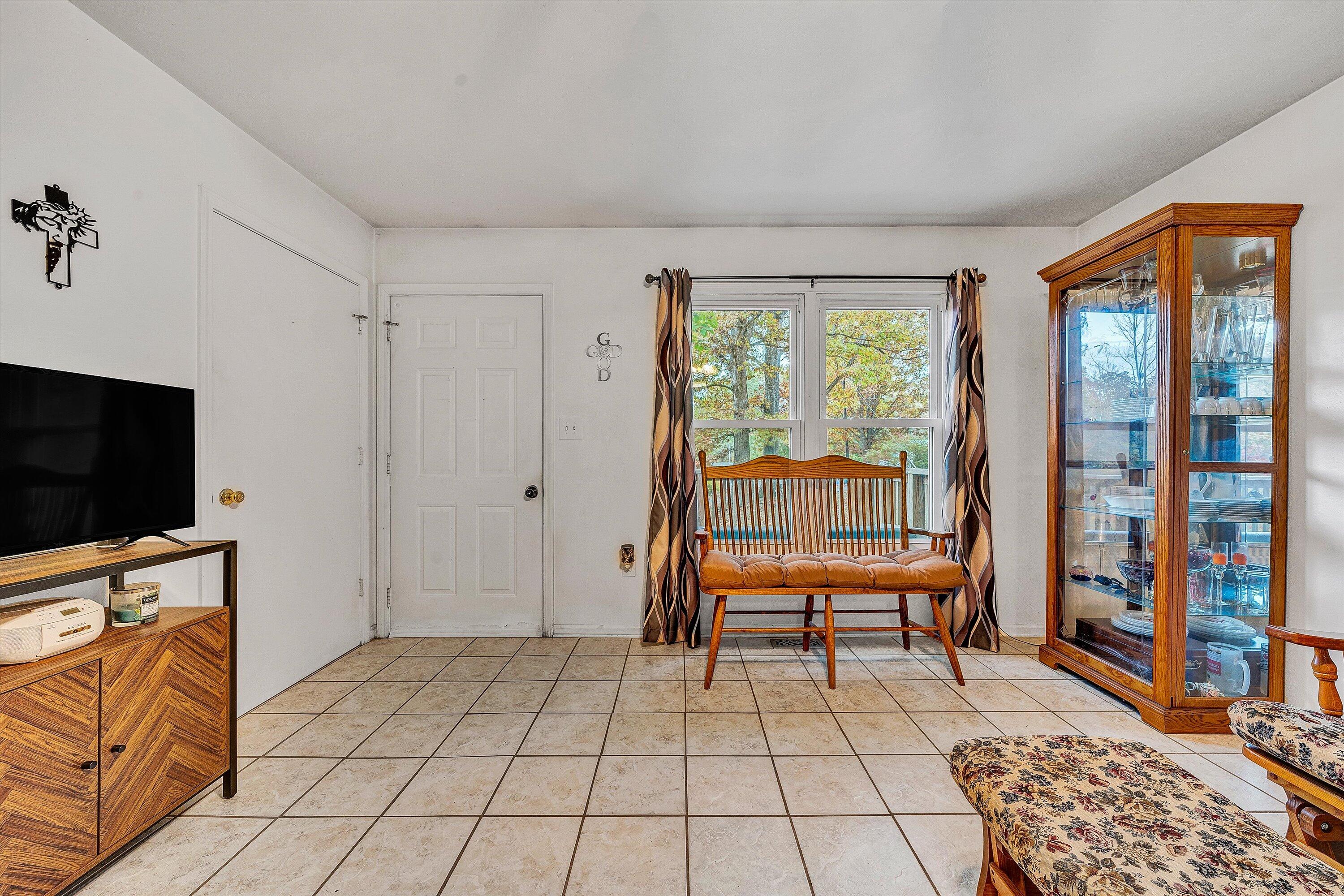 117 Country Lane Thaxton, VA 24174 - Photo 5 of 35 a bedroom with furniture and a flat screen tv