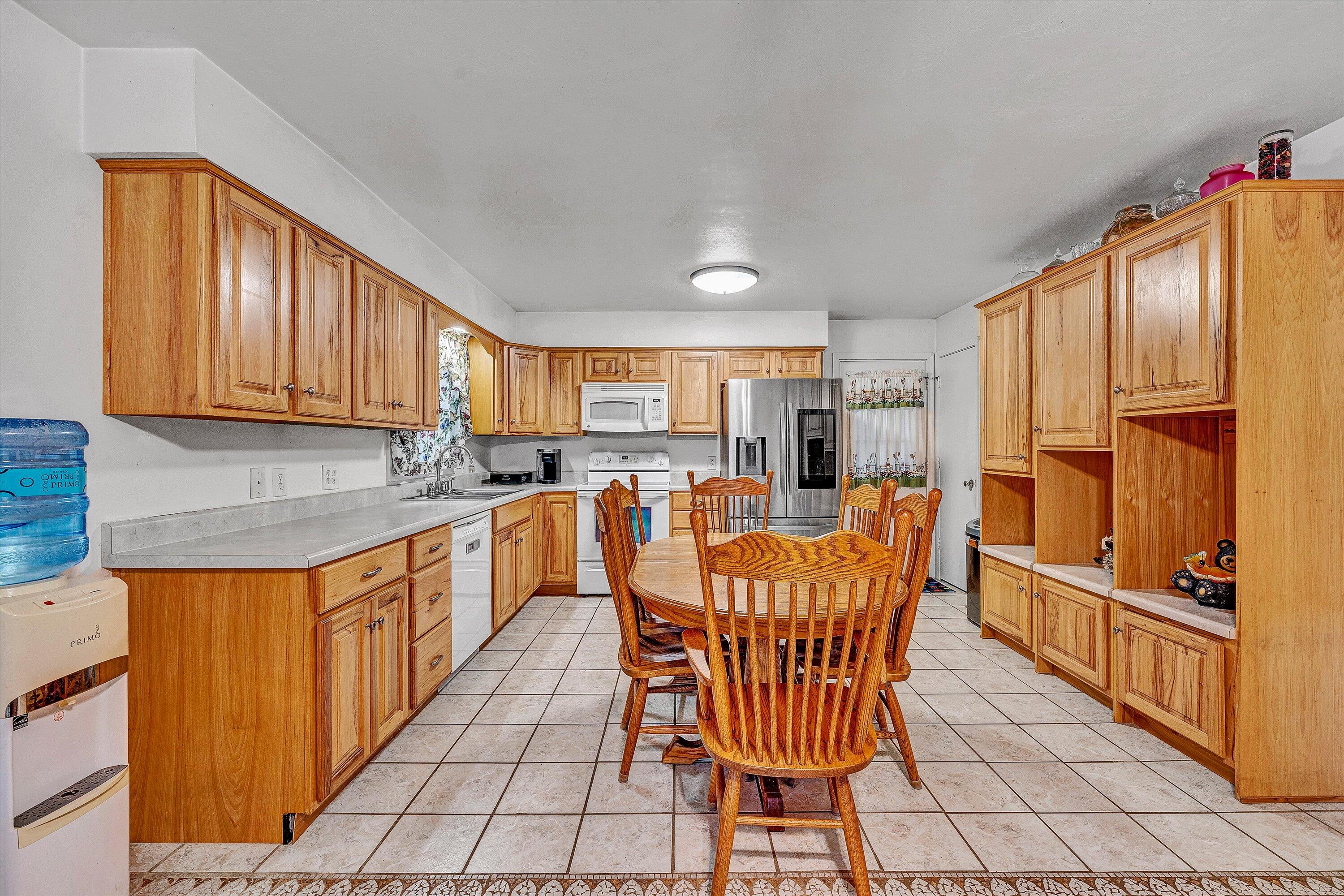 117 Country Lane Thaxton, VA 24174 - Photo 7 of 35 a kitchen with stainless steel appliances granite countertop a refrigerator and a stove top oven