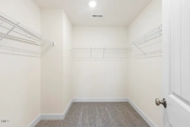 a view of a room with white walls