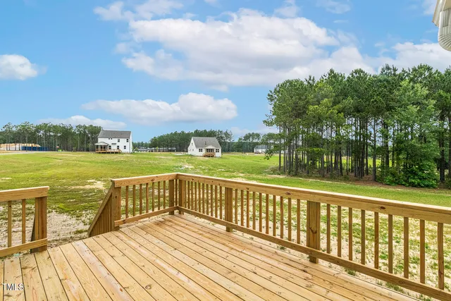 a view of a lake with wooden floor and city view