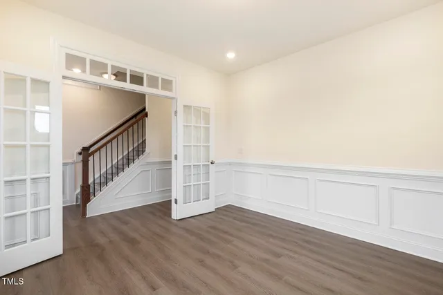 a view of an entryway with wooden floor