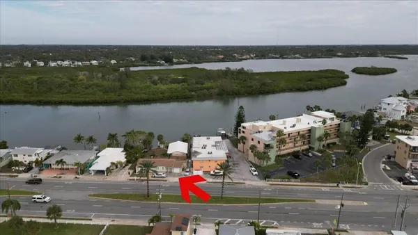 an aerial view of a houses with outdoor space