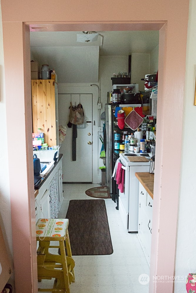 4202 Phinney Avenue North Seattle, WA 98103 - Photo 12 of 14 a utility room with sink dryer and washer
