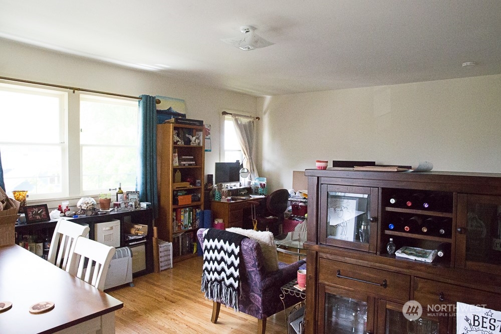 4202 Phinney Avenue North Seattle, WA 98103 - Photo 14 of 14 a living room with furniture and a fireplace