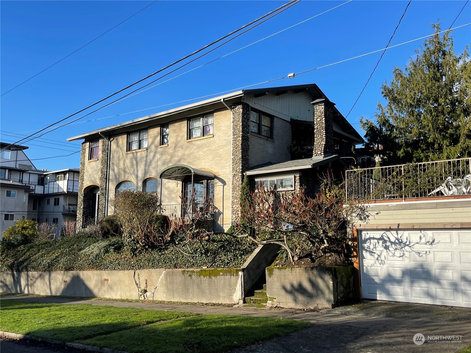 4202 Phinney Avenue North Seattle, WA 98103 - Photo 3 of 14 a front view of a house with a yard