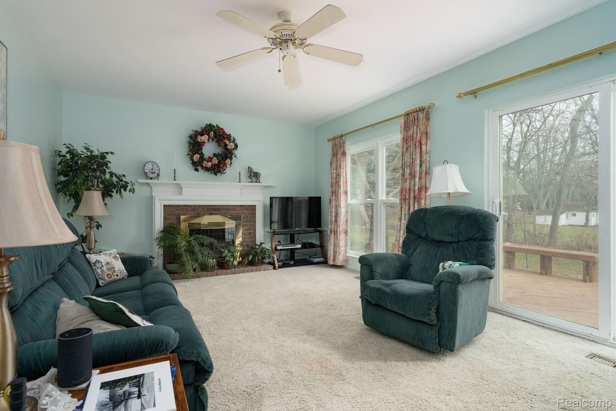 724 Whitney Drive Rochester, MI 48307 - Photo 12 of 26 Huge family room with fireplace