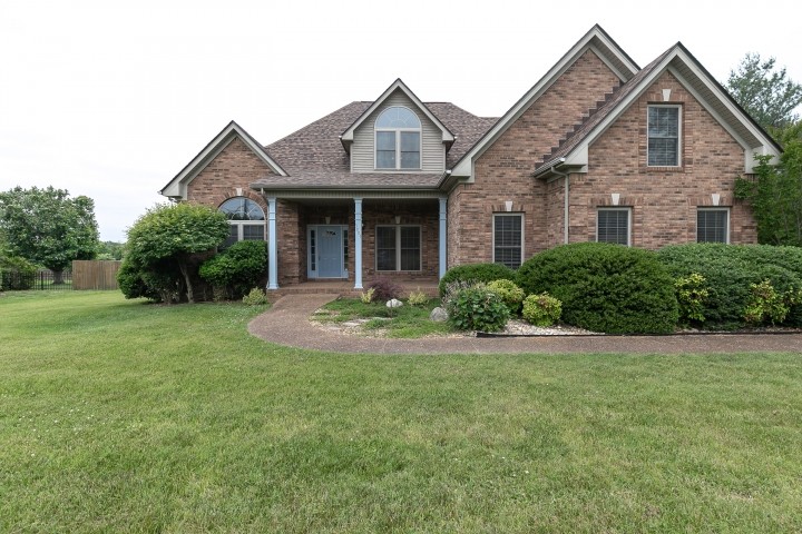 3003 Burts Crossing Springfield, TN 37172 - Photo 2 of 48 a front view of a house with a yard and garage