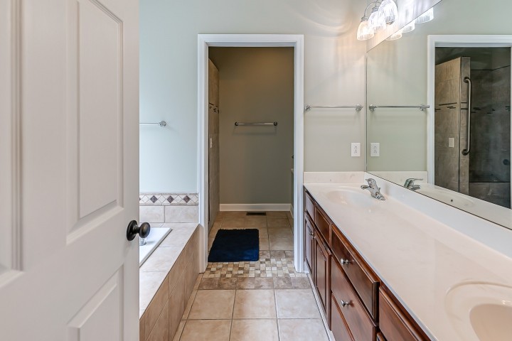 3003 Burts Crossing Springfield, TN 37172 - Photo 23 of 48 a bathroom with a tub sink and mirror