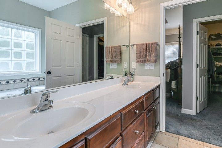 3003 Burts Crossing Springfield, TN 37172 - Photo 26 of 48 a bathroom with a sink and a large mirror