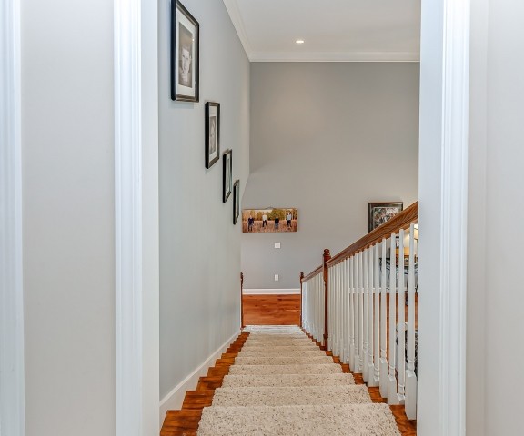 3003 Burts Crossing Springfield, TN 37172 - Photo 30 of 48 a view of a hallway with wooden floor and staircase