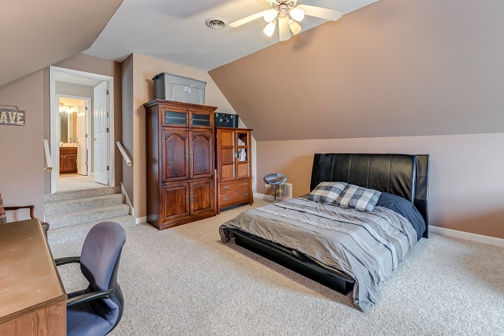 3003 Burts Crossing Springfield, TN 37172 - Photo 41 of 48 a bedroom with a bed a chair and dresser