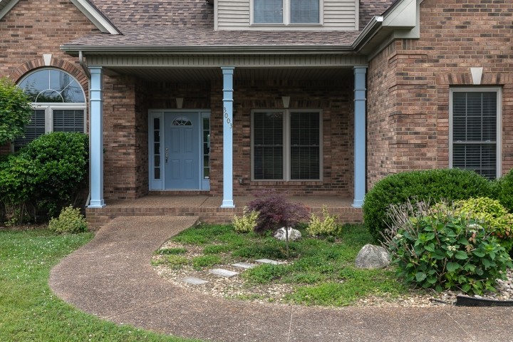 3003 Burts Crossing Springfield, TN 37172 - Photo 42 of 48 a front view of a house with garden