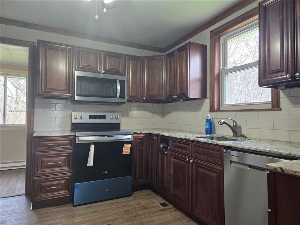 1425 Barclay Hill Road Beaver, PA 15009 - Photo 2 of 30 a kitchen with stainless steel appliances granite countertop a sink stove microwave and refrigerator