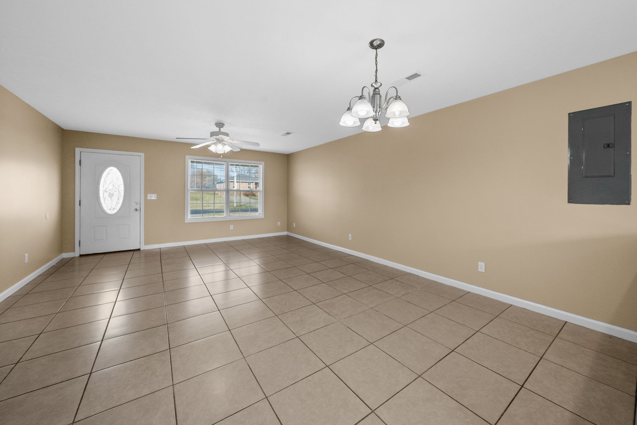 2278 Greenville Road Hopkinsville, KY 42240 - Photo 8 of 21 an empty room with windows and fan