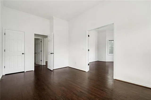 an empty room with wooden floor