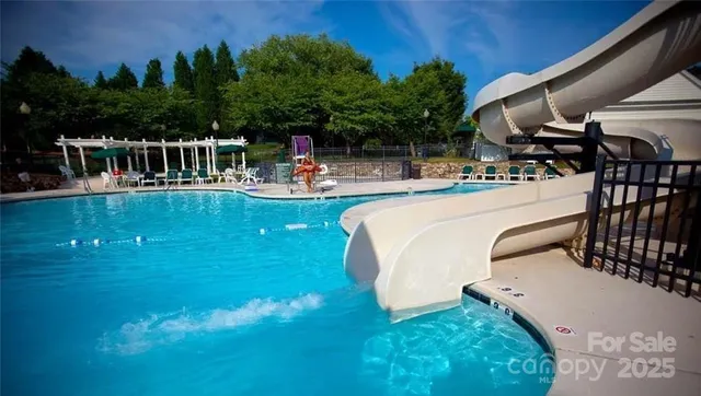 a view of a swimming pool with a patio