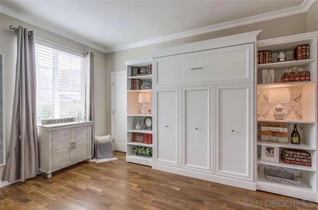 17628 Alva Road San Diego, CA 92127 - Photo 13 of 25 an empty room with closet and windows