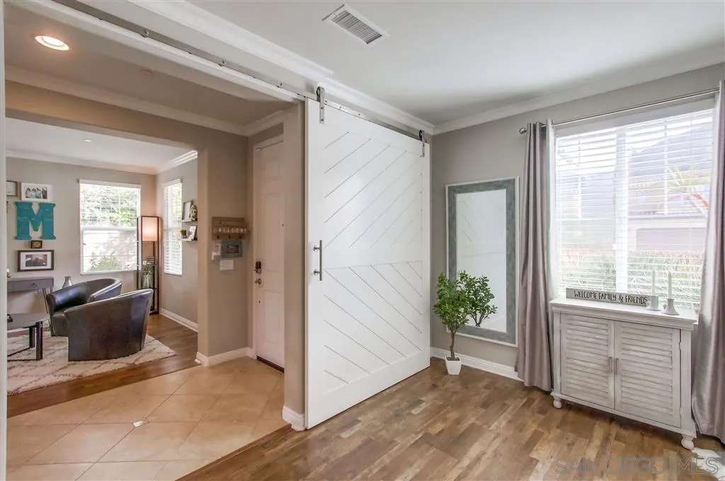 17628 Alva Road San Diego, CA 92127 - Photo 14 of 25 a view of a livingroom with wooden floor and furniture