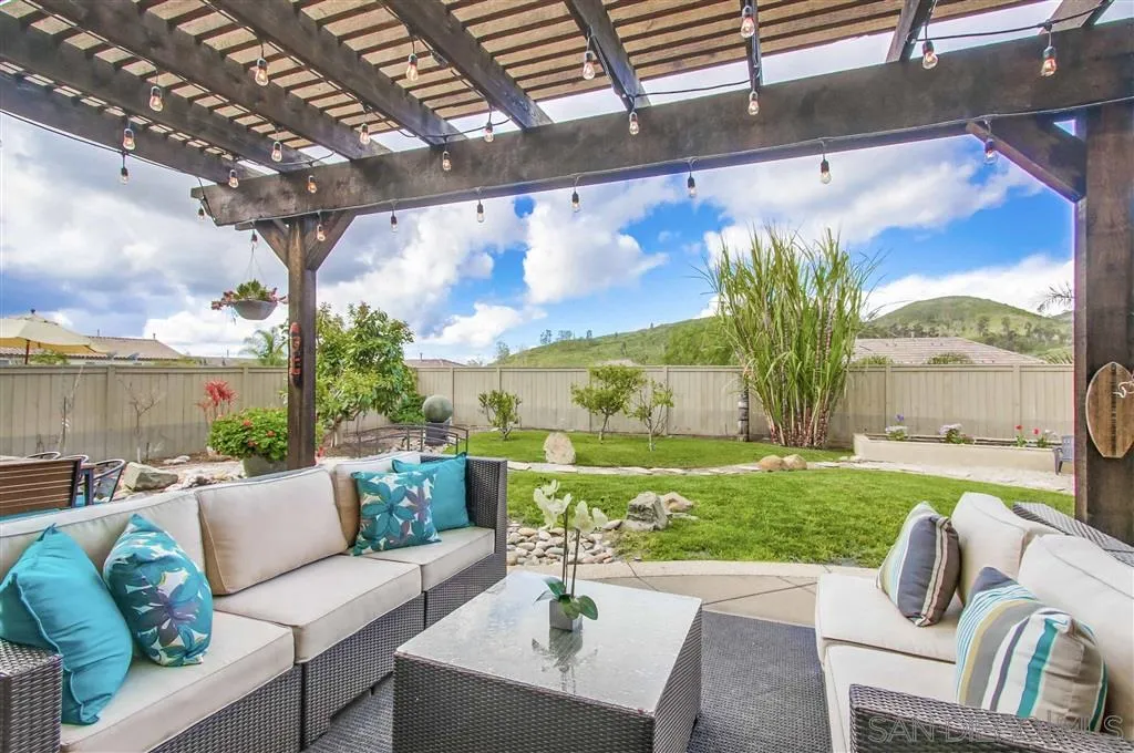 17628 Alva Road San Diego, CA 92127 - Photo 24 of 25 a balcony with furniture and a garden