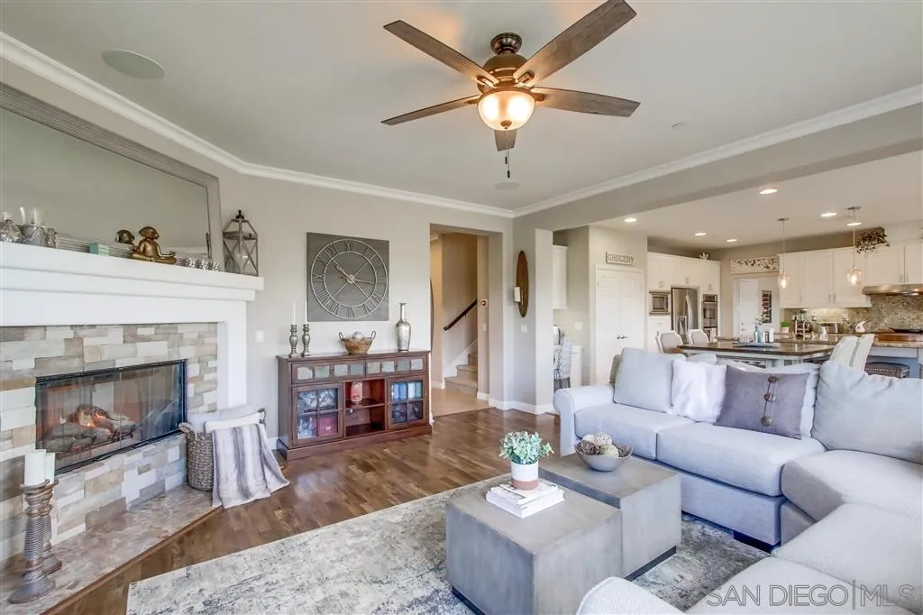 17628 Alva Road San Diego, CA 92127 - Photo 7 of 25 a living room with furniture and a fireplace