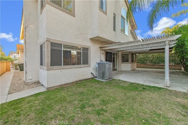a view of house with backyard porch and entertaining space
