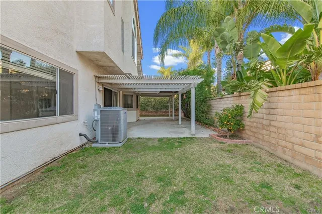 a view of house with swimming pool outdoor seating
