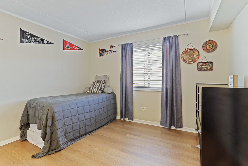 1233 Chalet Road, Unit 101 Naperville, IL 60563 - Photo 13 of 17 a room with a bed and a window