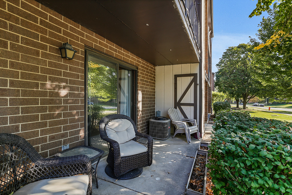 1233 Chalet Road, Unit 101 Naperville, IL 60563 - Photo 15 of 17 a outdoor living space with furniture and a potted plant