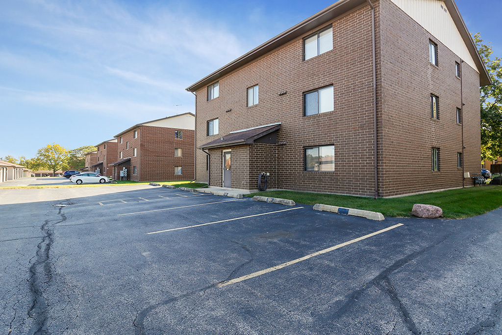 1233 Chalet Road, Unit 101 Naperville, IL 60563 - Photo 16 of 17 a view of a house with a yard