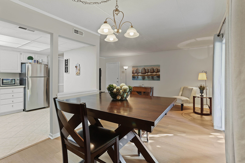 1233 Chalet Road, Unit 101 Naperville, IL 60563 - Photo 4 of 17 a view of a dining room and livingroom with furniture