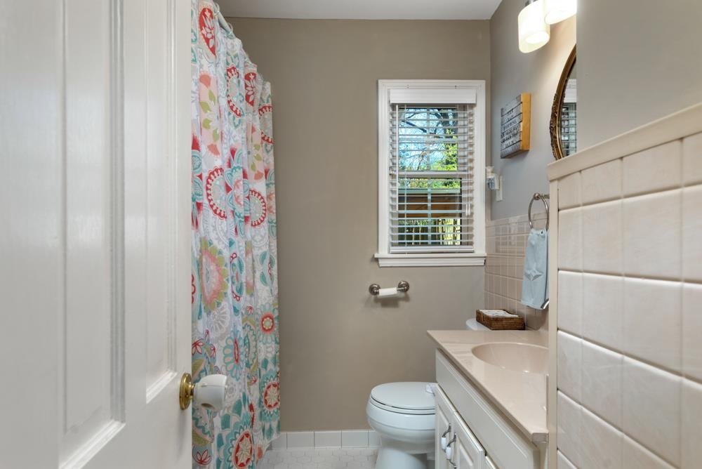 5219 Sequoia Road Memphis, TN 38120 - Photo 19 of 25 a bathroom with a sink toilet and shower