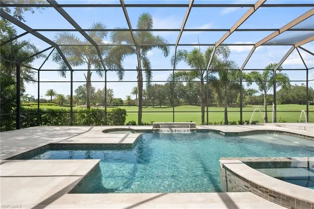 a view of a backyard and floor to ceiling windows