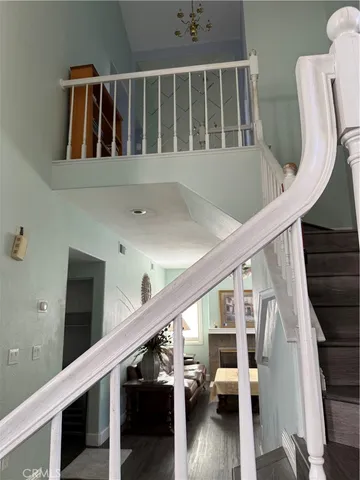 a kitchen that has a lot of white cabinets