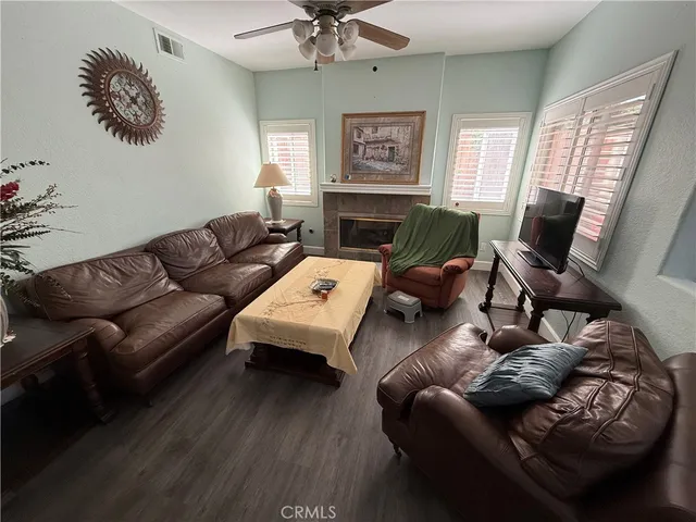 a living room with furniture and a fireplace