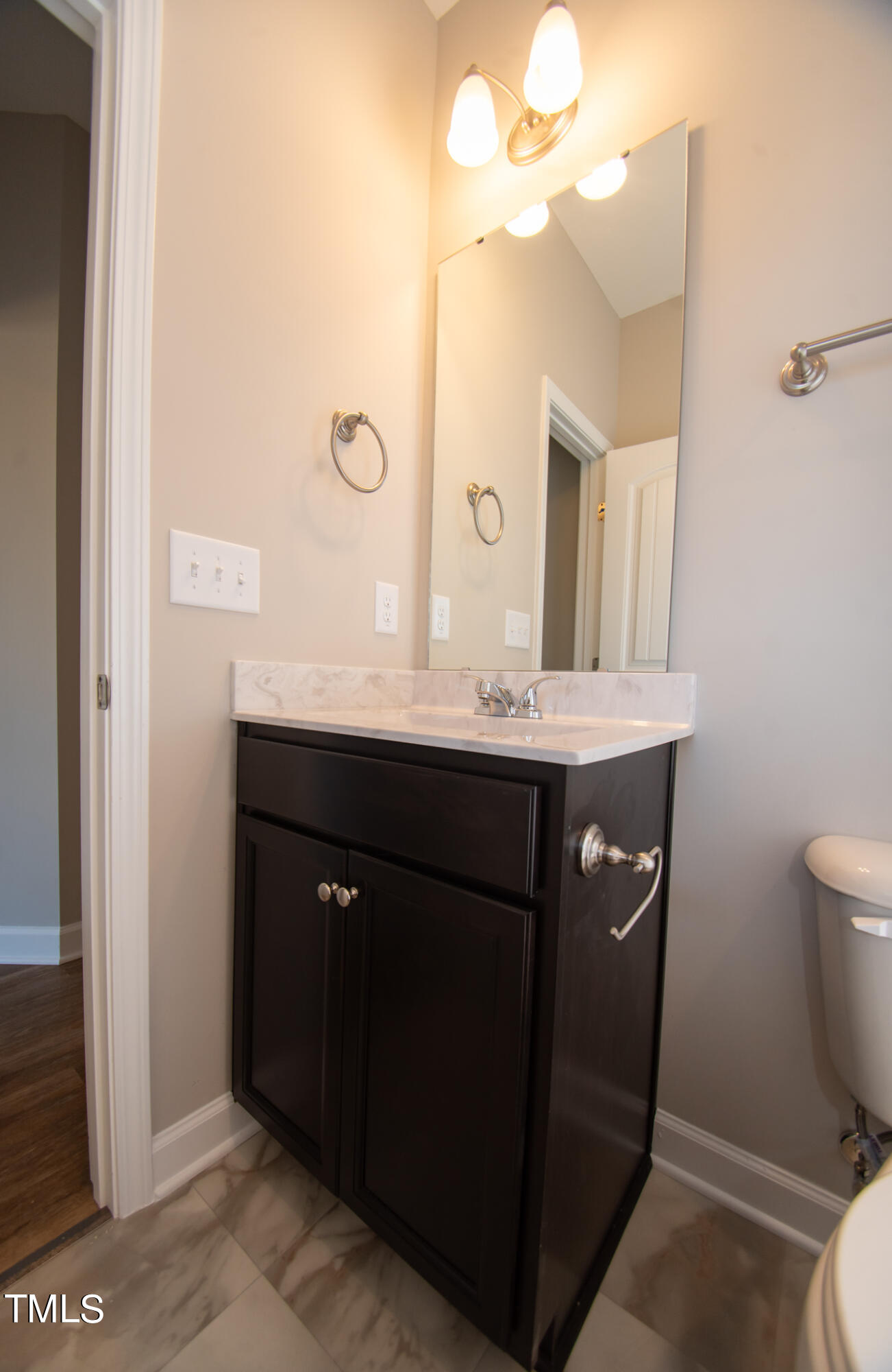 57 Waters Edge Drive Erwin, NC 28339 - Photo 18 of 59 a bathroom with a sink a toilet and a mirror