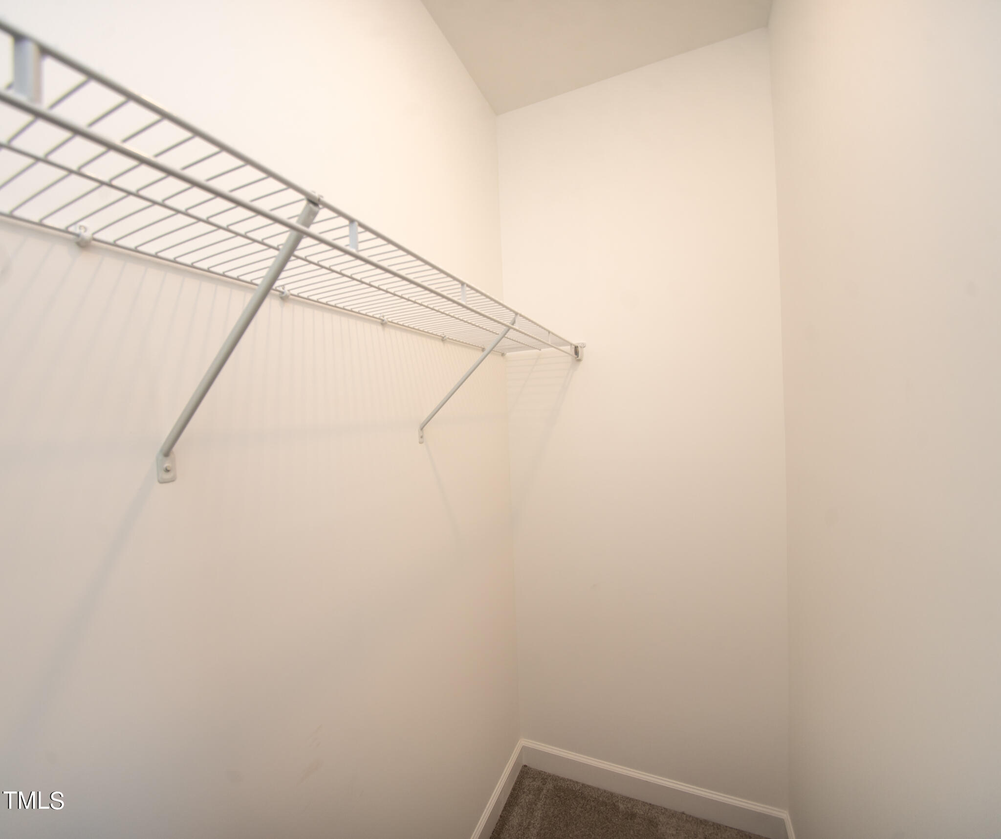 57 Waters Edge Drive Erwin, NC 28339 - Photo 21 of 59 a view of small space with empty racks on the wall