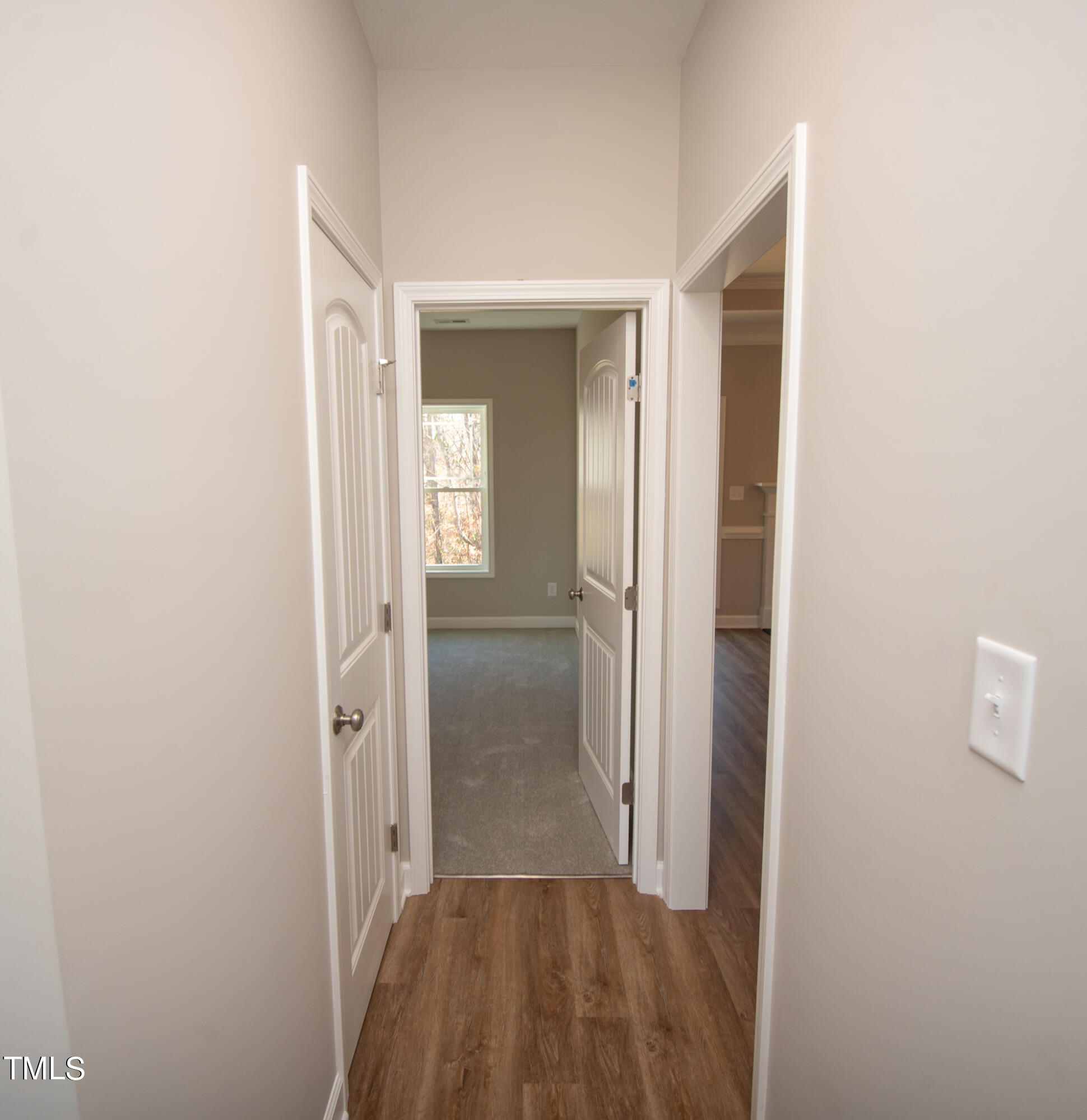 57 Waters Edge Drive Erwin, NC 28339 - Photo 23 of 59 a view of a hallway with wooden floor