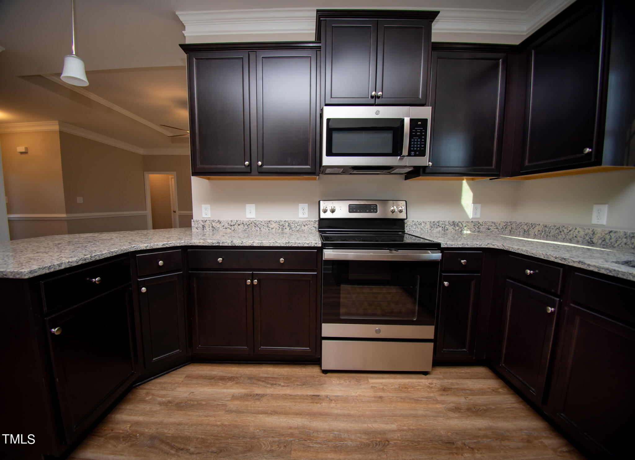 57 Waters Edge Drive Erwin, NC 28339 - Photo 31 of 59 a kitchen with granite countertop stainless steel appliances and wooden cabinets