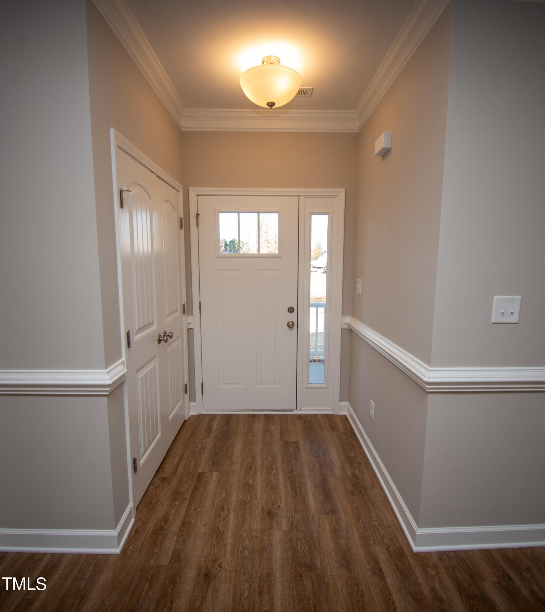 57 Waters Edge Drive Erwin, NC 28339 - Photo 36 of 59 a view of a hallway with wooden floor and staircase