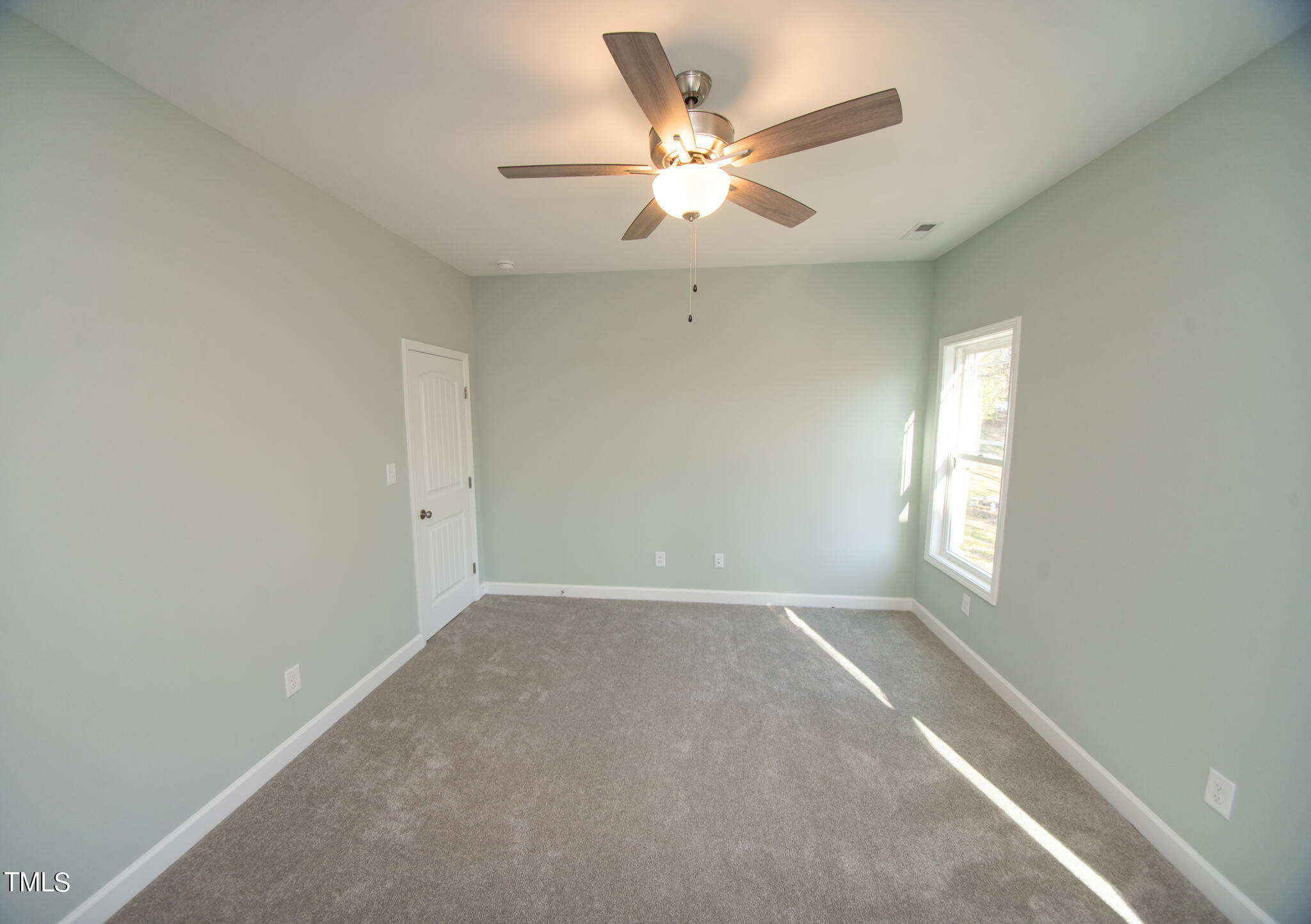 57 Waters Edge Drive Erwin, NC 28339 - Photo 54 of 59 an empty room with windows and fan