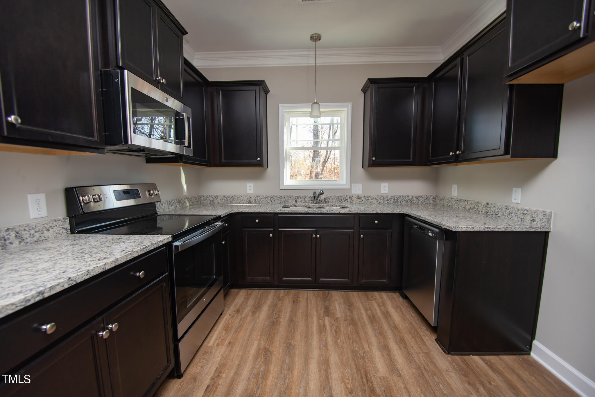 57 Waters Edge Drive Erwin, NC 28339 - Photo 57 of 59 a kitchen with granite countertop stainless steel appliances a stove sink and microwave