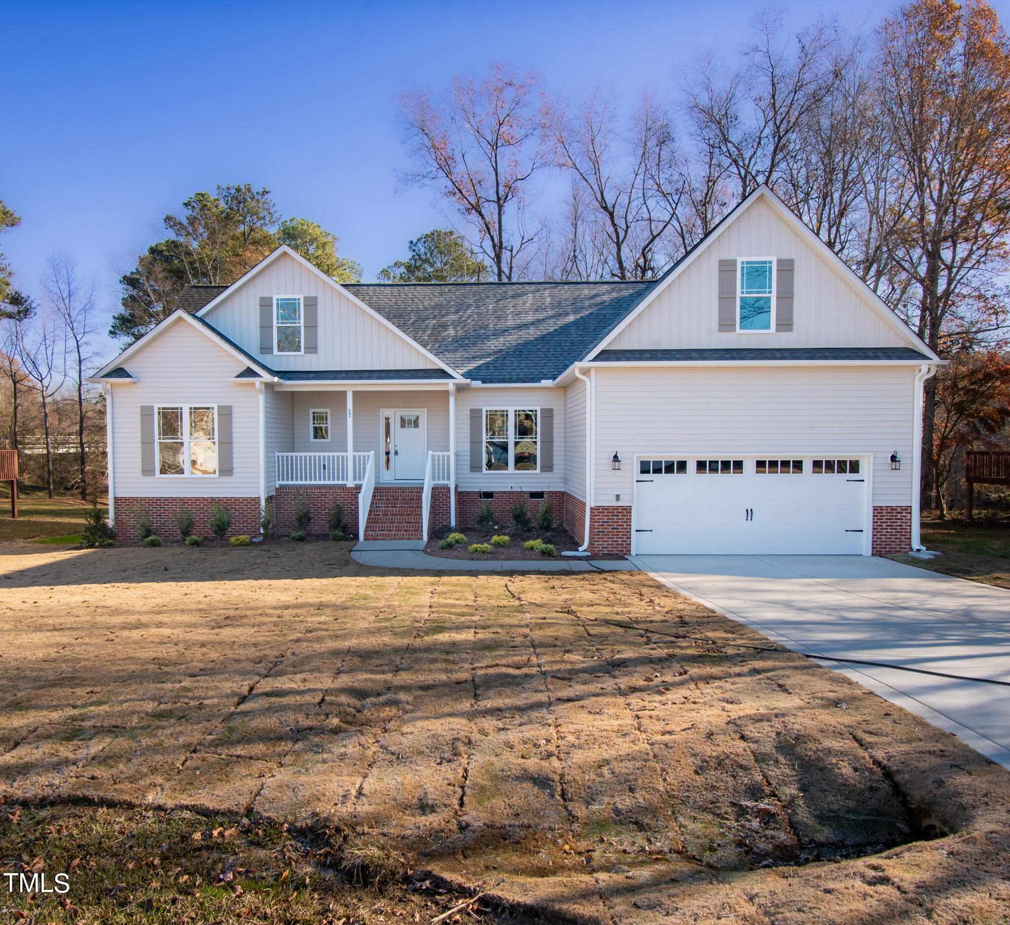 57 Waters Edge Drive Erwin, NC 28339 - Photo 58 of 59 a front view of a house with a yard