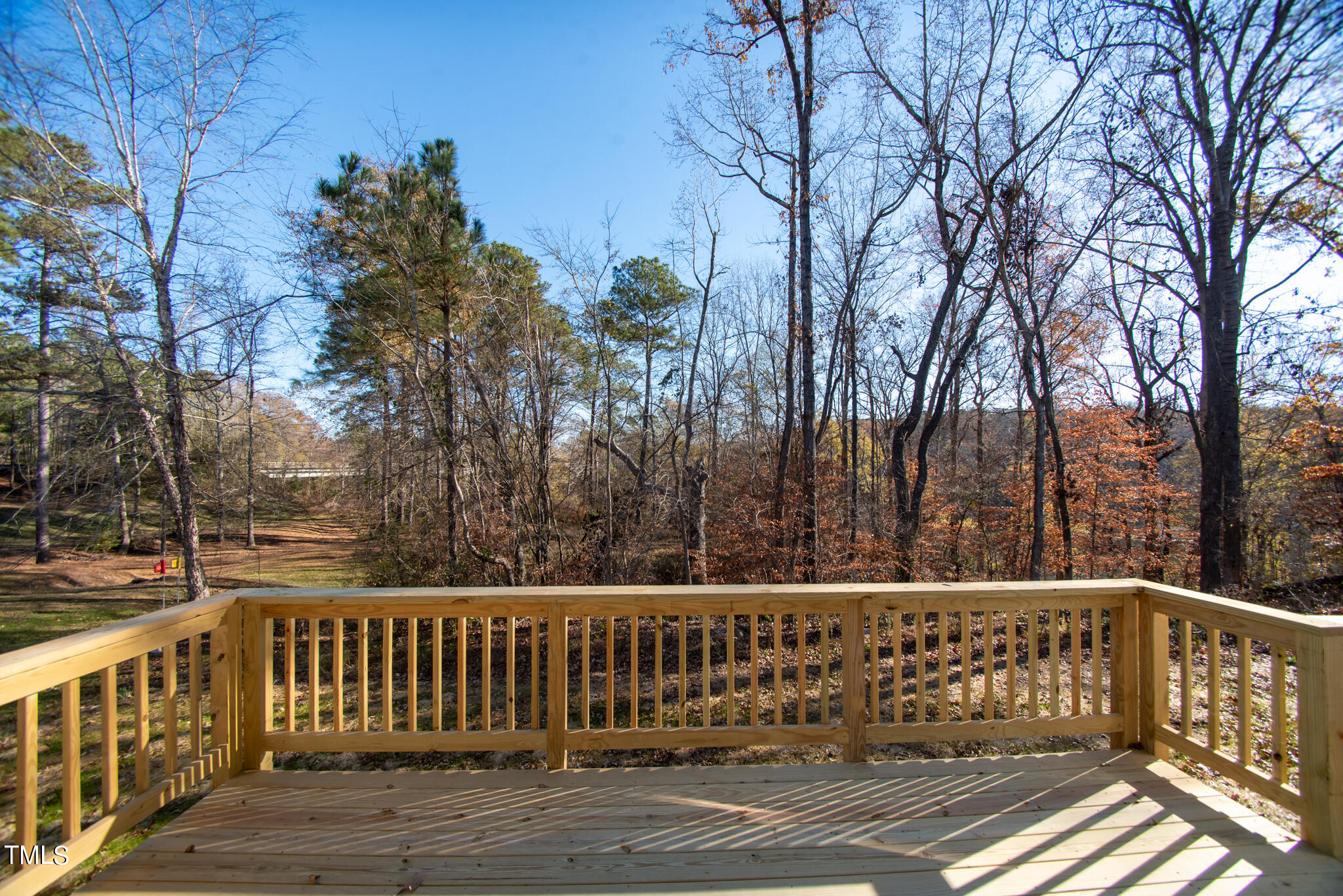 57 Waters Edge Drive Erwin, NC 28339 - Photo 8 of 59 a view of a wooden deck with trees with wooden fence