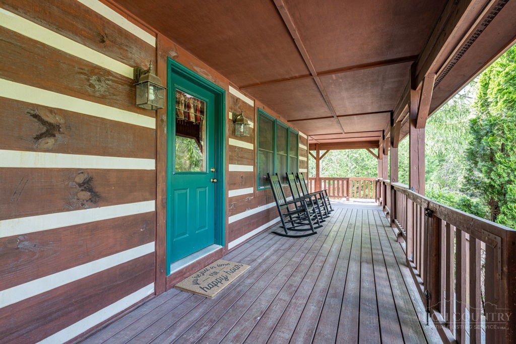 197 Woodby Ridge Road Vilas, NC 28692 - Photo 4 of 45 a view of balcony with couch