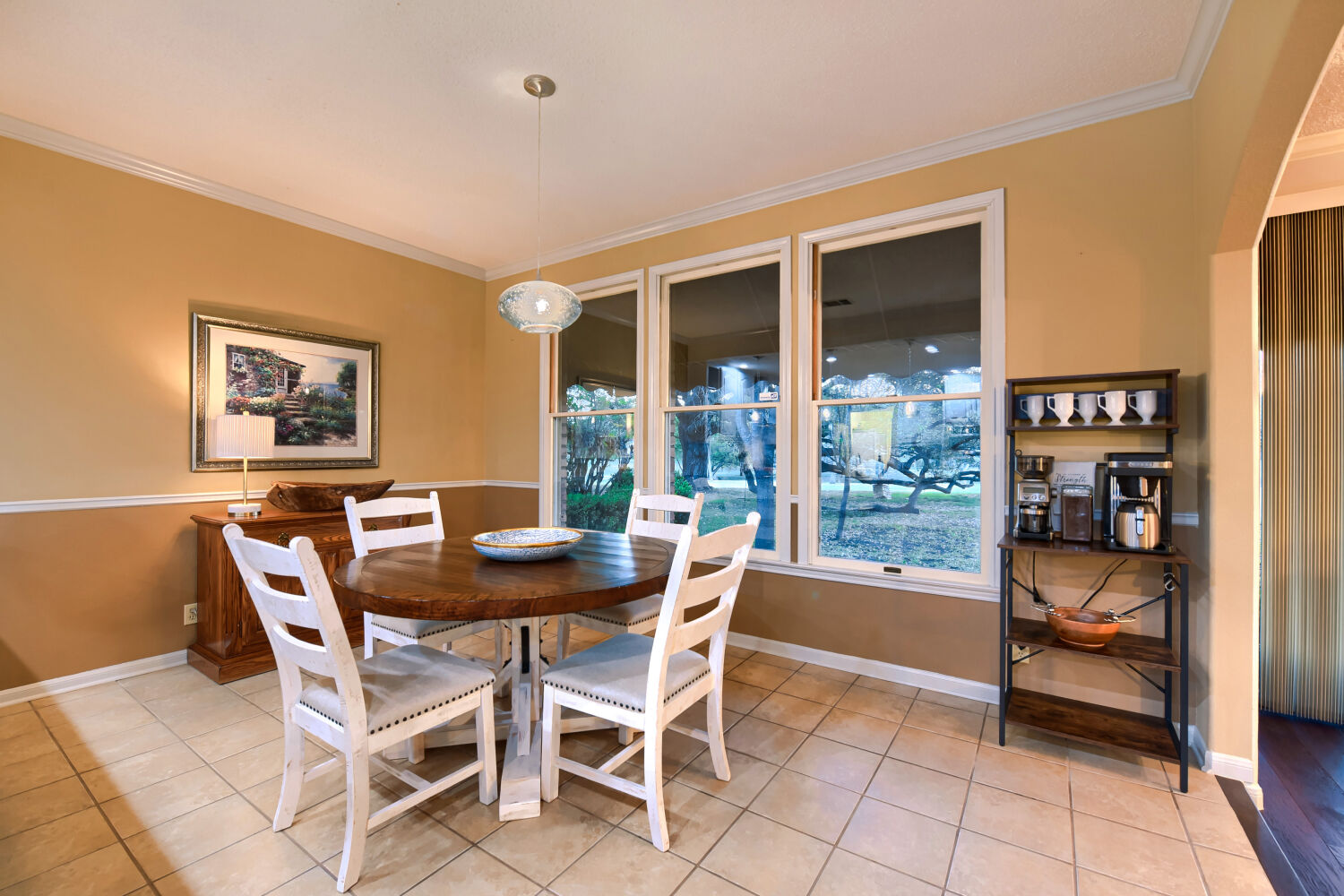 10904 Legends Lane Austin, TX 78747 - Photo 11 of 36 a dining room with furniture and large windows