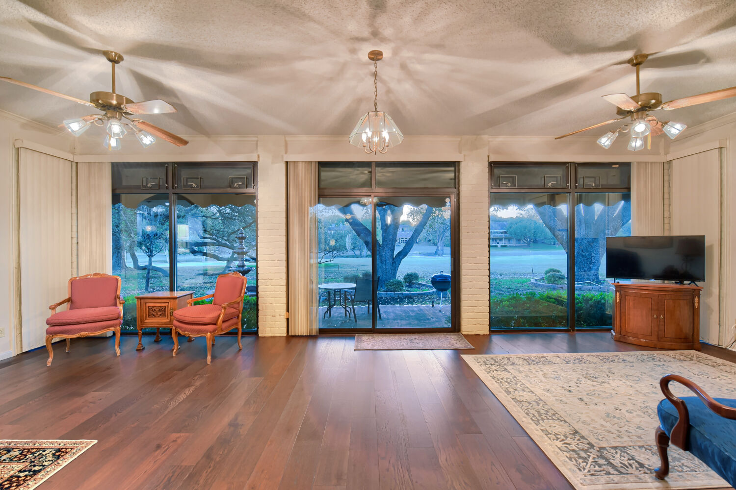 10904 Legends Lane Austin, TX 78747 - Photo 14 of 36 a living room with furniture and wooden floor